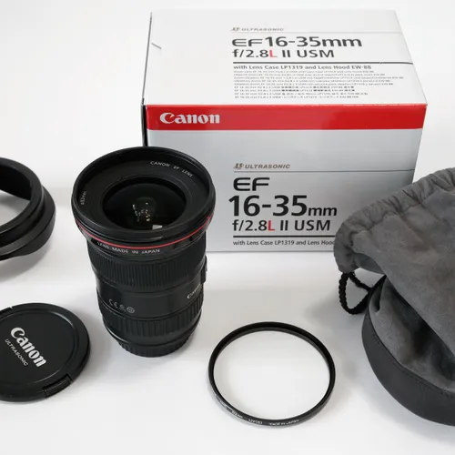 thumbnail-0 for Canon EF 16-35mm f/2.8 L II USM lens w/caps and lens hood