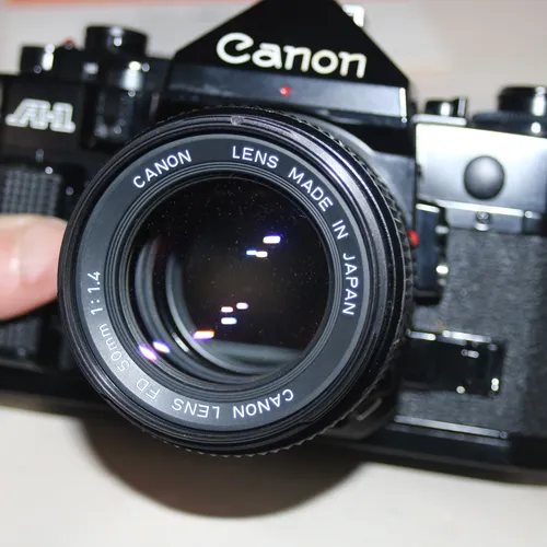 thumbnail-0 for Canon Lens 28mm f/2 with SLR Canon A-1 camera +bonus