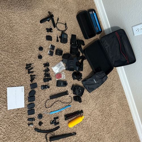 GoPro Hero 11 Kit with batteries, 50 part accessory kit, and memory card